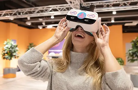 Woman wearing SPREE VR headset